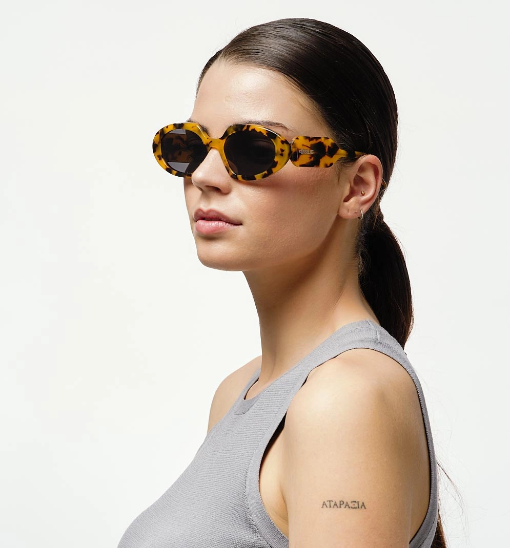 model wearing cosselie sunglasses glam yellow tortoise
